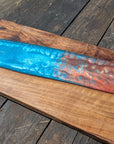 Walnut striking blue and bronze river board