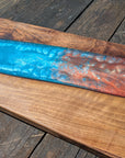 Walnut striking blue and bronze river board