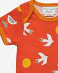 Premium organic cotton baby romper with seagull print, stylish GOTS-certified summer outfit, easy-wrap neck and snap leg closures by Toby Tiger at brixbailey.com
