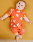 Premium organic cotton baby romper with seagull print, stylish GOTS-certified bright orange design, easy snap closure by Toby Tiger at brixbailey.com