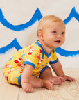 Charming Yellow Summer Romper for Baby’s First Beach Vacation, Soft Organic Cotton with Nautical Print and Snap Buttons by Toby Tiger at brixbailey.com