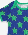 Premium baby romper with short legs, cute turtle print, snap buttons, soft organic cotton, sustainable summer outfit by Toby Tiger at brixbailey.com