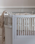Premium Sebra baby and junior cot bed in stylish stone grey, luxury handcrafted beech wood, adjustable height, convertible design by Ella James at brixbailey.com