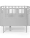 Luxury Sebra baby and junior cot bed in stone grey, premium handcrafted beech wood, adjustable height, stylish Nordic design by Ella James at brixbailey.com