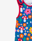 Premium organic cotton baby overall with floral mushroom print, soft red ankle bands, snap buttons, GOTS certified eco-friendly by Toby Tiger at brixbailey.com