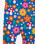 Premium organic cotton baby overall with floral mushroom print, red ankle bands, snap buttons, soft GOTS-certified fabric by Toby Tiger at brixbailey.com