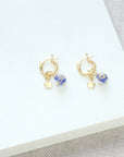 Luxury blue and gold Murano glass bead huggie hoop earrings with star charm, best-selling trending style by Lezzeri at brixbailey.com