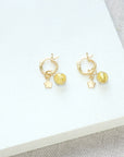 Shine On gold vermeil huggie earrings with star charm and Murano glass bead, luxury lightweight stacking hoops by Lezzeri at brixbailey.com