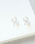 luxury sterling silver shine on huggie earrings with star charm and murano glass bead, trending best-selling stackable huggie hoops by Lezzeri at brixbailey.com
