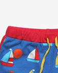 Luxury organic sailboat print shorts, premium soft 100% GOTS certified cotton, stylish red trim, adjustable yellow drawstring by Toby Tiger at brixbailey.com