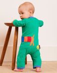 Premium organic cotton baby sleep suit with dog applique, GOTS certified, soft green romper with snap buttons by Toby Tiger at brixbailey.com