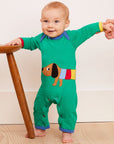 Premium green organic cotton baby sleep romper with dog applique, GOTS certified, snap button closure, soft and comfortable by Toby Tiger at brixbailey.com