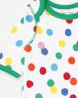 Colorful confetti print organic cotton baby sleep suit with contrast trim, snap buttons, slip-on neck by Toby Tiger at brixbailey.com