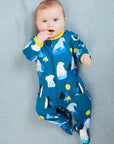 Premium blue organic cotton baby pajamas with penguins, walruses, polar bears, and Arctic print, soft yellow trim, snap buttons, footed design by Toby Tiger at brixbailey.com