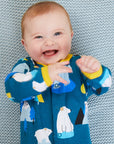Premium blue Arctic animal sleepsuit with penguins, walruses, polar bears, icebergs, and mountains, soft organic cotton, snap closure, footed pajamas by Toby Tiger at brixbailey.com