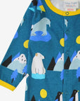 Premium blue organic cotton baby pajamas with arctic animals print, cozy yellow trim, snap buttons, closed feet by Toby Tiger at brixbailey.com