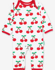 Premium organic cotton pajamas with cherry print, stylish red trim, slip-on neckline, snap buttons, soft GOTS-certified fabric by Toby Tiger at brixbailey.com