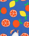 Premium organic cotton pajama set with citrus print, stylish sleepwear with slip-on neckline and snap buttons, soft GOTS-certified fabric by Toby Tiger at brixbailey.com