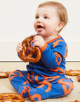 Premium Dark Blue Organic Cotton Baby Wrap with Pretzel Print and Snap Buttons for Easy Diaper Changes by Toby Tiger at brixbailey.com