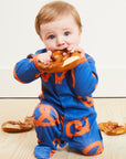 Premium Dark Blue Baby Swaddle Wrap with Fun Pretzel Print, Soft Organic Cotton and Snap Buttons for Easy Diaper Changes by Toby Tiger at brixbailey.com