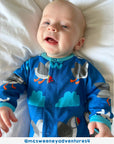 Adorable Organic Sleepsuit for Kids with Toby Tiger Sun Clouds and Waves Design by Toby Tiger at brixbailey.com