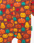 Premium organic cotton pumpkin print baby sleep suit, cozy footed pajamas with snap buttons, autumn-themed GOTS certified by Toby Tiger at brixbailey.com