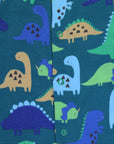 Cozy Dino Print Baby Footed Romper in Soft Organic Cotton for Relaxed Sleep by Toby Tiger at brixbailey.com