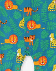 Premium baby sleepwear with lion print, 100% organic cotton, soft and comfortable, fully buttoned for easy diaper changes, GOTS certified by Toby Tiger at brixbailey.com