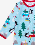 Premium GOTS Organic Cotton Baby Christmas Pajamas with Penguins and Snowmen, Snap Button Footie for Easy Diaper Changes by Toby Tiger at brixbailey.com