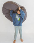 The MINICAMP Bouclé Fabric Kids Floor Cushion in Grey - Cozy & Stylish for Playtime by Minicamp at brixbailey.com