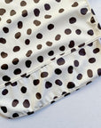 Long Sleeved Baby Bib - Spotty print
