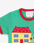Stylish Green Organic Cotton T-Shirt with Farmhouse Applique, Red Trim, and Snap Buttons for Easy Dressing by Toby Tiger at brixbailey.com