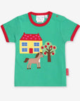 Premium Green Organic Cotton T-Shirt with Farmhouse Applique, Red Trim, and Snap Buttons for Easy Dressing by Toby Tiger at brixbailey.com