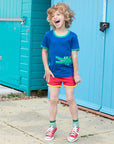 Premium baby crocodile applique t-shirt in muted blue with rainbow details, snap neck closure, soft organic cotton, sustainable kids fashion by Toby Tiger at brixbailey.com