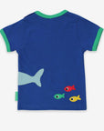 Premium baby organic cotton T-shirt with cute shark and fish applique, soft sustainable fabric, snap neck closure, royal blue with green trim by Toby Tiger at brixbailey.com