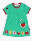 Premium green summer dress with short sleeves, GOTS certified organic cotton, fruit appliques, red trim, stylish Toby Tiger design by Toby Tiger at brixbailey.com