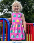 Organic pear print summer dress, stylish pink sleeveless kids dress, soft GOTS-certified cotton, trending yellow-green fruit pattern, premium handcrafted boho design by Toby Tiger at brixbailey.com
