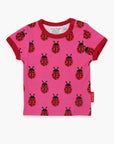 Premium Pink Ladybug Print Baby T-Shirt with Red Trim, Snap Closure, 100% GOTS Organic Cotton, Eco-Friendly Dyes by Toby Tiger at brixbailey.com