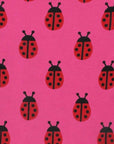 Premium Pink Ladybug Print Baby T-Shirt with Red Trim and Snap Buttons, 100% GOTS Certified Organic Cotton by Toby Tiger at brixbailey.com