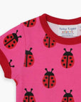 Premium Pink Ladybug Print Baby T-Shirt with Red Trim, Snap Buttons, 100% GOTS Certified Organic Cotton by Toby Tiger at brixbailey.com