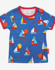Premium organic kids summer T-shirt with sailboat print, stylish red trim, deep blue GOTS-certified cotton, trendy nautical design by Toby Tiger at brixbailey.com