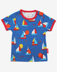 Premium kids organic cotton t-shirt with sailboat print, stylish red trim, deep blue background, playful fish details, GOTS certified, easy snap neck closure by Toby Tiger at brixbailey.com