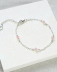 Stardrop Figaro chain bracelet with shimmering crystals, dusty pink sterling silver, stylish dainty jewelry, best-selling luxury accessory by Lezzeri at brixbailey.com