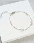 Stardrop Figaro chain bracelet with shimmering crystals, dusty pink sterling silver, stylish dainty jewelry, best-selling luxury accessory by Lezzeri at brixbailey.com