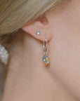 Luxury sterling silver hoops with crescent moon and Murano glass sun charm, elegant sun and moon earrings by Lezzeri at brixbailey.com