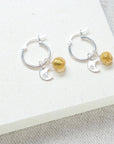 Luxury sterling silver hoops with crescent moon and Murano glass sun charm, elegant sun and moon earrings for all occasions by Lezzeri at brixbailey.com