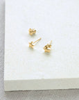 Luxury celestial star stud earrings, gold vermeil, dainty stacking studs with shimmering textured edges by Lezzeri at brixbailey.com