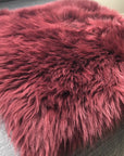 Premium British sheepskin seat cover, 37cm square, burgundy, luxury free-range organic sheepskin, handcrafted in London, sustainable and hypoallergenic by Wildash London at brixbailey.com
