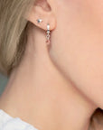 Luxury celestial star stud earrings, dainty sterling silver stacking studs with shimmering textured edges by Lezzeri at brixbailey.com