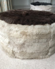 Luxury Cossack shearling pouffe, round champagne conker footstool, premium upcycled sheepskin, handcrafted in England, modern traditional decor by Wildash London at brixbailey.com